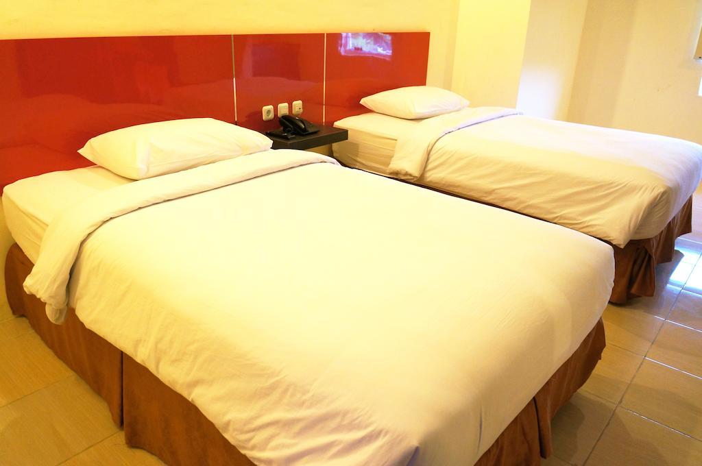 Quin Centro Hotel Palembang Habitación foto